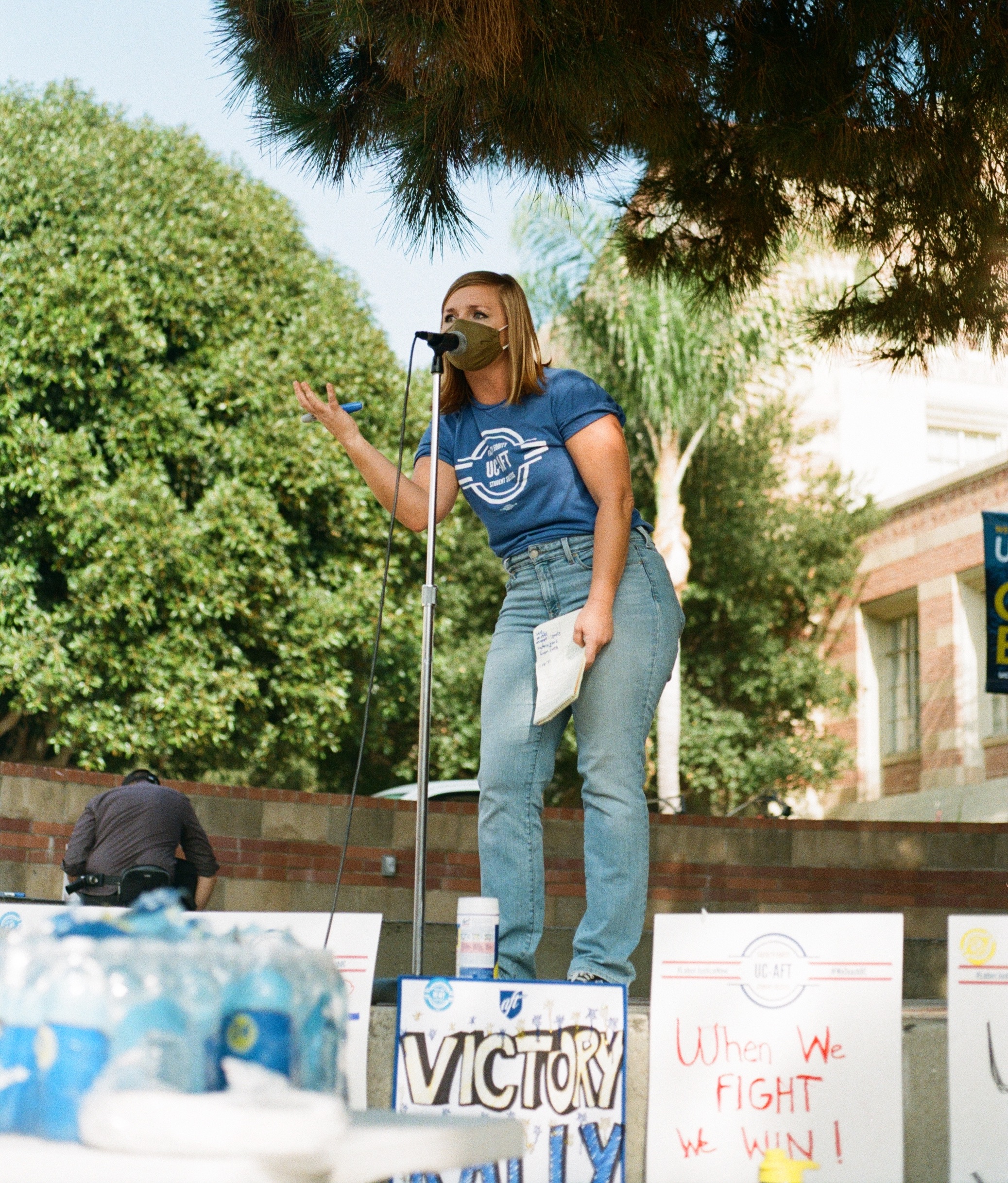 photo of a UC AFT lecturers union member giving a speech in Bruin Plaza