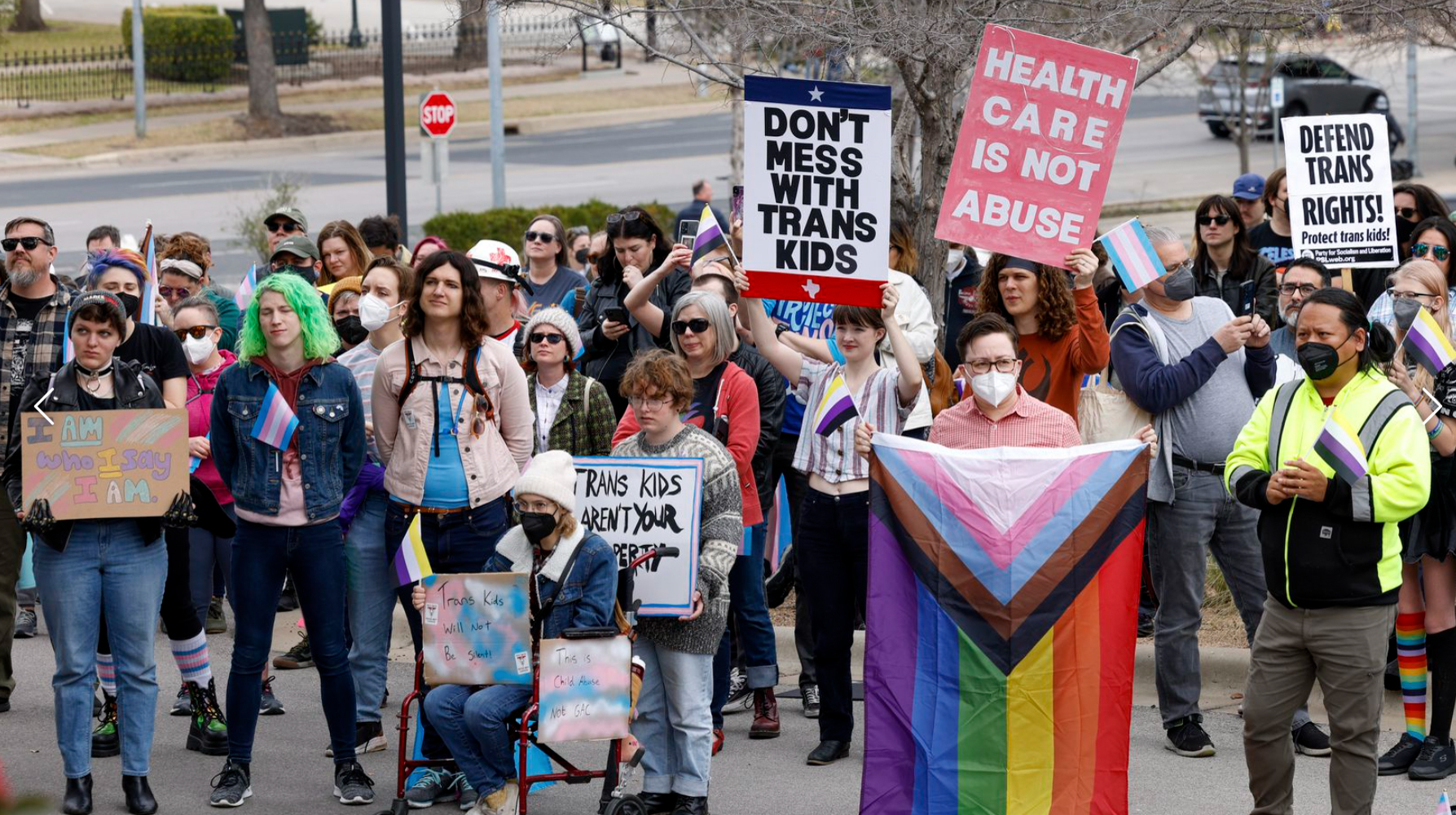 photo of protestors against anti-trans legislation outside Texas' governor's mansion
