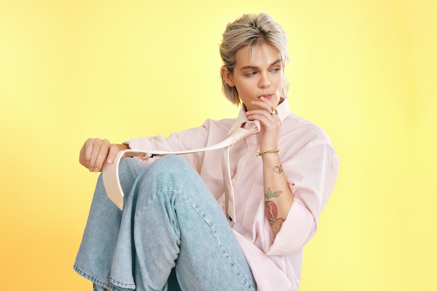 a photo of Annelle Staal, a white nonbinary singer-songwriter with short choppy bleached hair