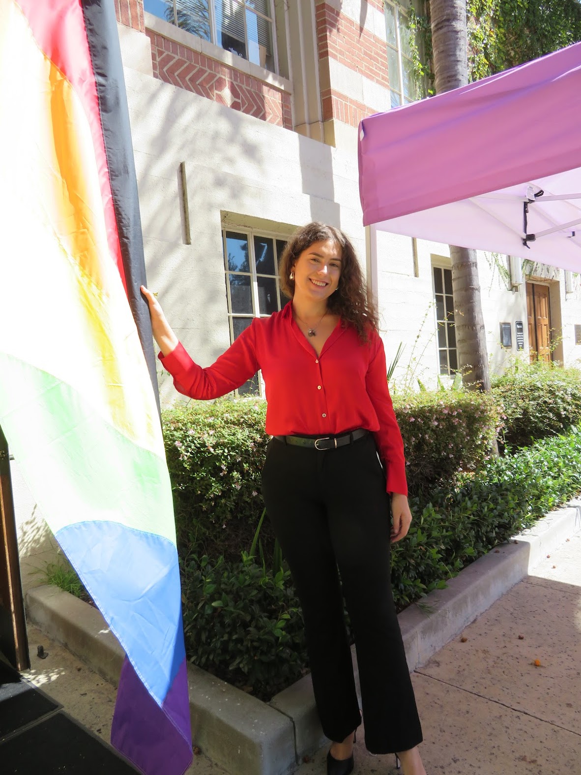 Director Vanessa Gonzalez-Siegel stands in front of UCLA's LGBTQ Campus Resource Center